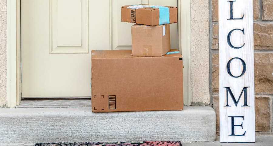 Deliveries on the front porch of a house with a welcome sign in Los Angeles